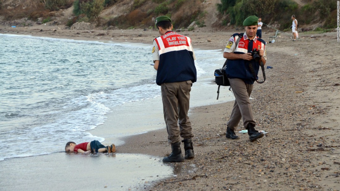 Authorities stand near the lifeless body of 2-year-old Aylan Kurdi on the shore of Bodrum, Turkey, on Wednesday, September 2. Aylan, his brother, Galip, and their mother <a href="http://www.cnn.com/2015/09/03/europe/migration-crisis-aylan-kurdi-turkey-canada/index.html" target="_blank">drowned while fleeing Syria</a>. This photo was shared around the world, often with a Turkish hashtag that means "Flotsam of Humanity."