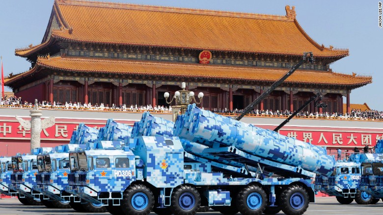Military vehicles carry missiles past the Tiananmen Gate on September 3.