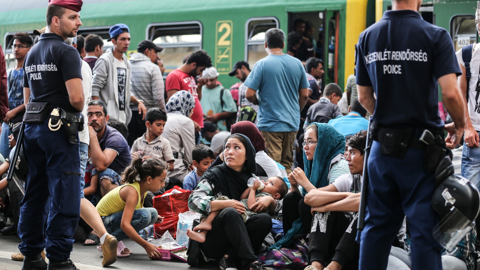 Chaos as migrants forced off trains in Hungary