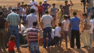 Drowned Syrian toddler and family laid to rest