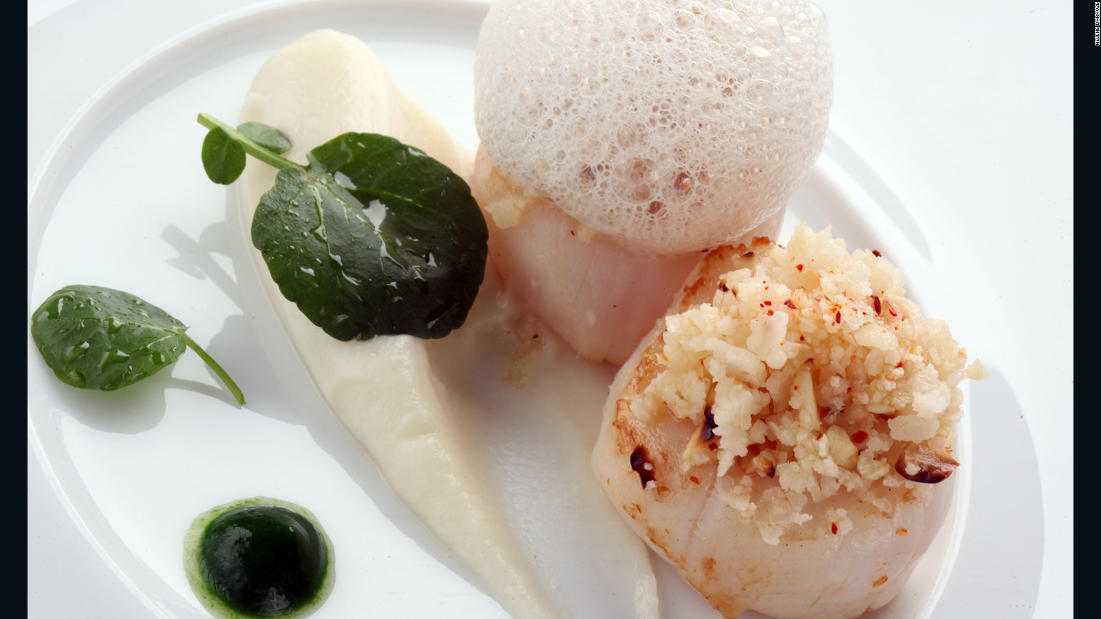 On the menu: Scallops with cauliflower and hazelnut couscous, cauliflower mousseline, garlic emulsion and parsley jus.