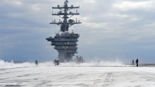 Sailors test the countermeasure washdown system on the flight deck of the Nimitz-class aircraft carrier USS Dwight D. Eisenhower (CVN 69) during sea trials prior to returning to its homeport at Naval Station Norfolk in late August 2015.
