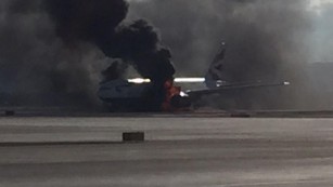 Thick black smoke billows out of British Airways Flight 2276 on Tuesday in Las Vegas. 