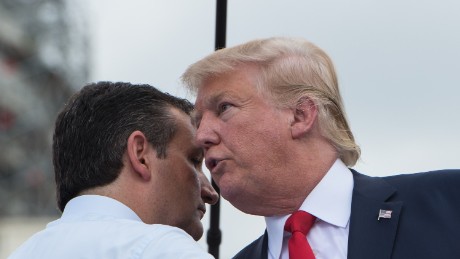 US Republican presidential candidate Donald Trump (R) is greeted on stage by fellow Republican candidate Ted Cruz before speaking at a rally organized by the Tea Party Patriots against the Iran nuclear deal in front of the Capitol in Washington, DC, on September 9, 2015.  AFP PHOTO/NICHOLAS KAMM        (Photo credit should read NICHOLAS KAMM/AFP/Getty Images)