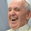 Pope Francis laughs while addressing journalists of the papal flight, upon arrival in Rio de Janeiro on July 22, 2013. Pope Francis landed in Brazil on Monday for his first overseas trip as pontiff to attend the international festival World Youth Day in Brazil, the world's biggest Catholic country.    AFP PHOTO/LUCA ZENNARO/POOL        (Photo credit should read LUCA ZENNARO/AFP/Getty Images)