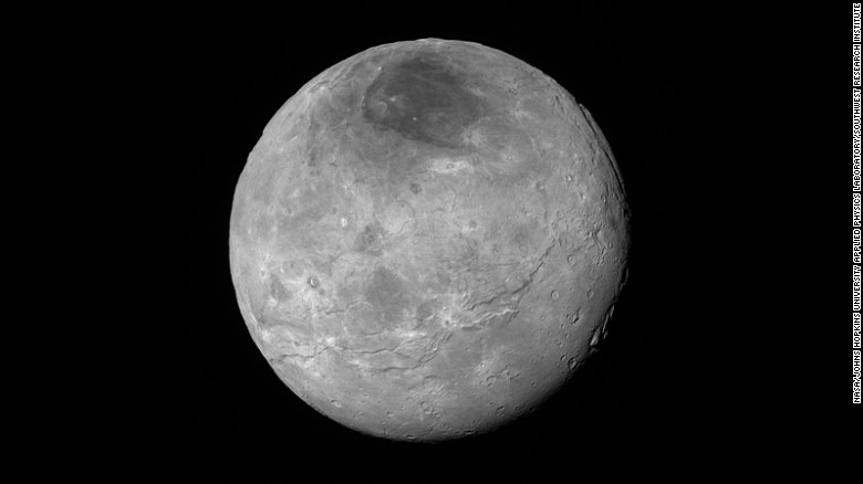 Just before its closest approach to Pluto on July 14, NASA&#39;s New Horizons spacecraft snapped this photo of Charon, Pluto&#39;s largest moon. The photo was shot at a distance of 290,000 miles away.  Charon&#39;s north pole region is markedly dark. This photo was released on September 10.