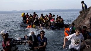 Migrants arrive on the Greek island of Lesbos after crossing the Aegean Sea.