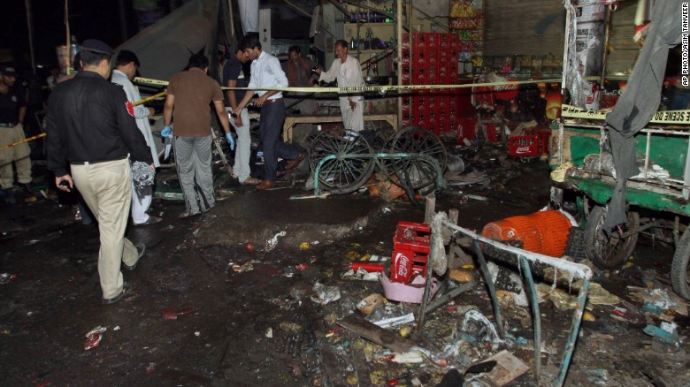 Police examine an explosion site in Multan, Pakistan, on September 13, 2015.