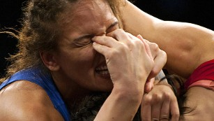 Sep 10, 2015; Las Vegas, NV, USA; Aline Da Silva Ferreira of Brazil (blue) takes fingers in her eyes from Vasilisa Marzaliuk of Belarus (red) at The Orleans Arena. Mandatory Credit: Stephen R. Sylvanie-USA TODAY Sports