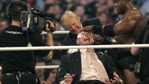 DETROIT - APRIL 1: WWE chairman Vince McMahon (C) has his head shaved by Donald Trump (L) and Bobby Lashley (R) after losing a bet in the Battle of the Billionaires at the 2007 World Wrestling Entertainment's Wrestlemania at Ford Field on April 1, 2007 in Detroit, Michigan. Umaga was representing McMahon in the match when he lost to Bobby Lashley who was representing Trump. (Photo by Bill Pugliano/Getty Images)
