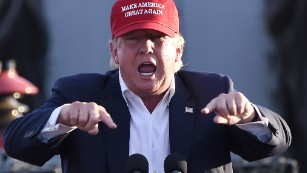 Republican presidential candidate Donald Trump gives a national security speech aboard the World War II Battleship USS Iowa, September 15, 2015, in San Pedro, California.   AFP PHOTO /ROBYN BECK        (Photo credit should read ROBYN BECK/AFP/Getty Images)