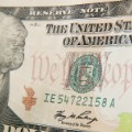 A close-up of the front of the US 10-dollar bill bearing the portrait of Alexander Hamilton, America's first Treasury Secretary, is seen on December 7, 2010 in Washington, DC. Various security features are imprinted into the bank note.  Different denomination security threads have various colors which are visible when lit by ultra-violet light. The security features found in United States currency are selected after extensive testing and evaluation of hundreds of bank note security devices, many of which are used successfully by other countries with lower production and circulation demands.   AFP PHOTO / Paul J. RICHARDS (Photo credit should read PAUL J. RICHARDS/AFP/Getty Images)