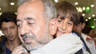 Spain welcomes Syrian dad tripped by camerawoman