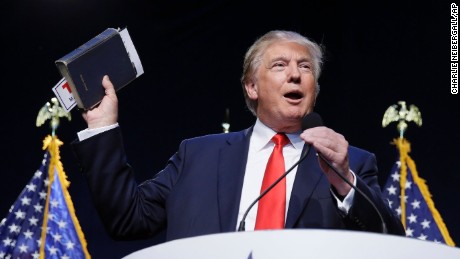 Republican presidential candidate, businessman Donald Trump holds a Bible as he speaks during the Iowa Faith &amp;amp; Freedom Coalition&amp;#39;s annual fall dinner, Saturday, Sept. 19, 2015, in Des Moines, Iowa. (AP Photo/Charlie Neibergall)