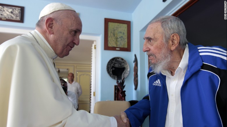 Pope Francis and Fidel Castro shake hands on Sunday afternoon.