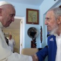 Pope Francis and Cuba's Fidel Castro shakes hands, in Havana, Cuba, Sunday, Sept. 20, 2015. The Vatican described the 40-minute meeting at Castro's residence as informal and familial, with an exchange of books. (AP Photo/Alex Castro)