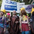 British fashion designer Vivienne Westwood (C) takes part in a demonstration ahead of her show during the Spring / Summer 2016 London Fashion Week in London on September 20, 2015.  AFP PHOTO / LEON NEAL        (Photo credit should read LEON NEAL/AFP/Getty Images)