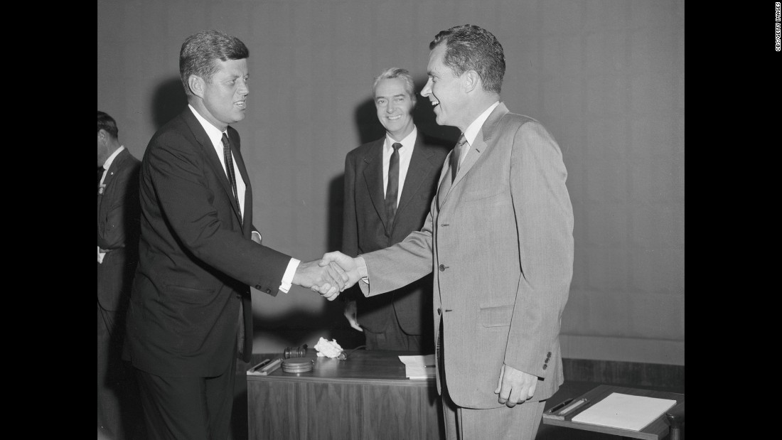 The candidates shake hands as moderator Howard K. Smith looks on. The one-hour debate took place in Chicago at the studios of CBS affiliate WBBM.