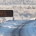 A solitary car makes its way along the snowbound M8 motorway connecting Scotland's two biggest cities, Glasgow and Edinburgh