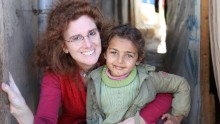 Barbara Massaad poses with a refugee child at the Zahle Lebanon. Her experience at the camp inspired her to create the humanitarian cookbook "Soup for Syria."
