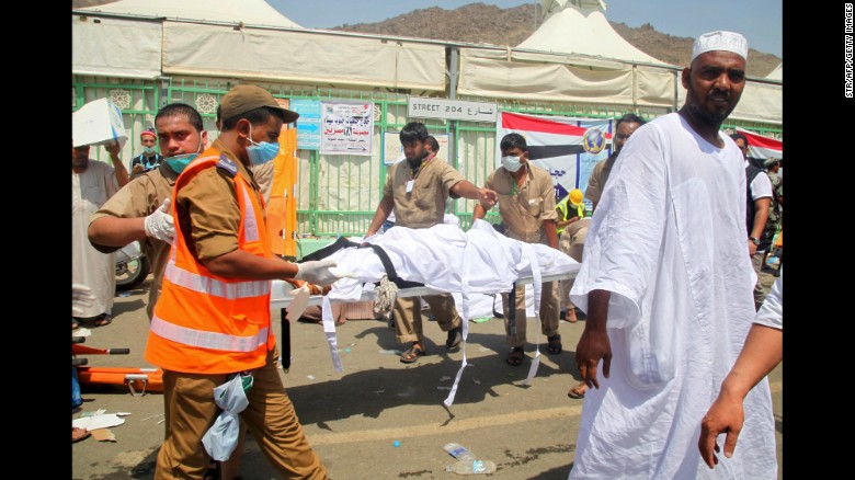 Saudi emergency personnel carry a body at the site of a stampede Thursday, September 24, in Mina, near Mecca, Islam's holiest city. Thursday morning's stampede killed hundreds during one of the last rituals of the<a href="http://www.cnn.com/2015/09/23/world/gallery/hajj/index.html"> Hajj, the annual Islamic pilgrimage</a>.