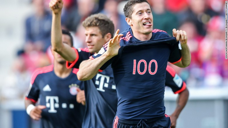  Robert Lewandowski of Muenchen celebrates with team mate Thomas Mueller during the Bundesliga match between Mainz and FC Bayern Munich at the Coface Arena.