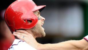 WASHINGTON, DC - SEPTEMBER 27:  Bryce Harper #34 of the Washington Nationals is grabbed by Jonathan Papelbon #58 in the eighth inning against the Philadelphia Phillies at Nationals Park on September 27, 2015 in Washington, DC.  (Photo by Greg Fiume/Getty Images)