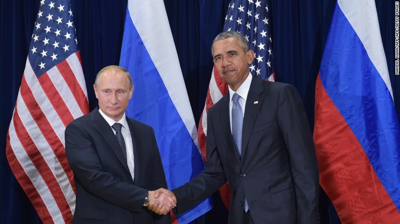 US President Barack Obama and Russia's President Vladimir Putin shake hands while posing for a photo ahead of a bilateral meeting on the sidelines of the 70th session of the UN General Assembly at the United Nations headquarters on September 28, 2015 in New York. 