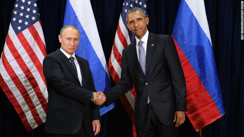 Obama and Putin shake hands while posing for a photo ahead of their meeting at U.N. headquarters on September 28 in New York.