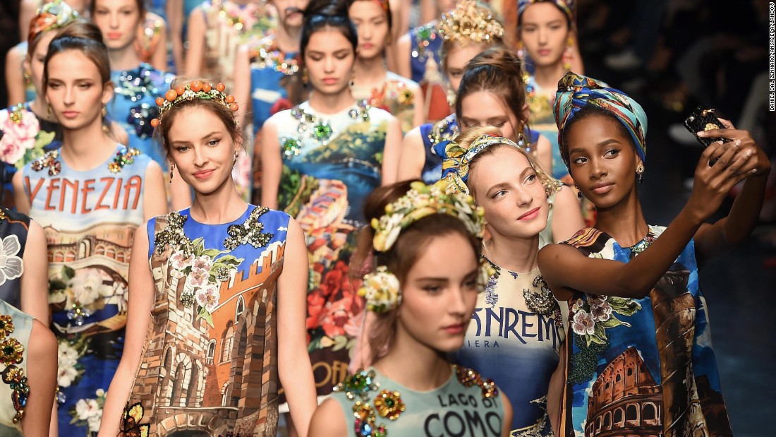 Models take selfies during a Dolce &amp;amp; Gabbana fashion show in Milan, Italy, on Sunday, September 27.