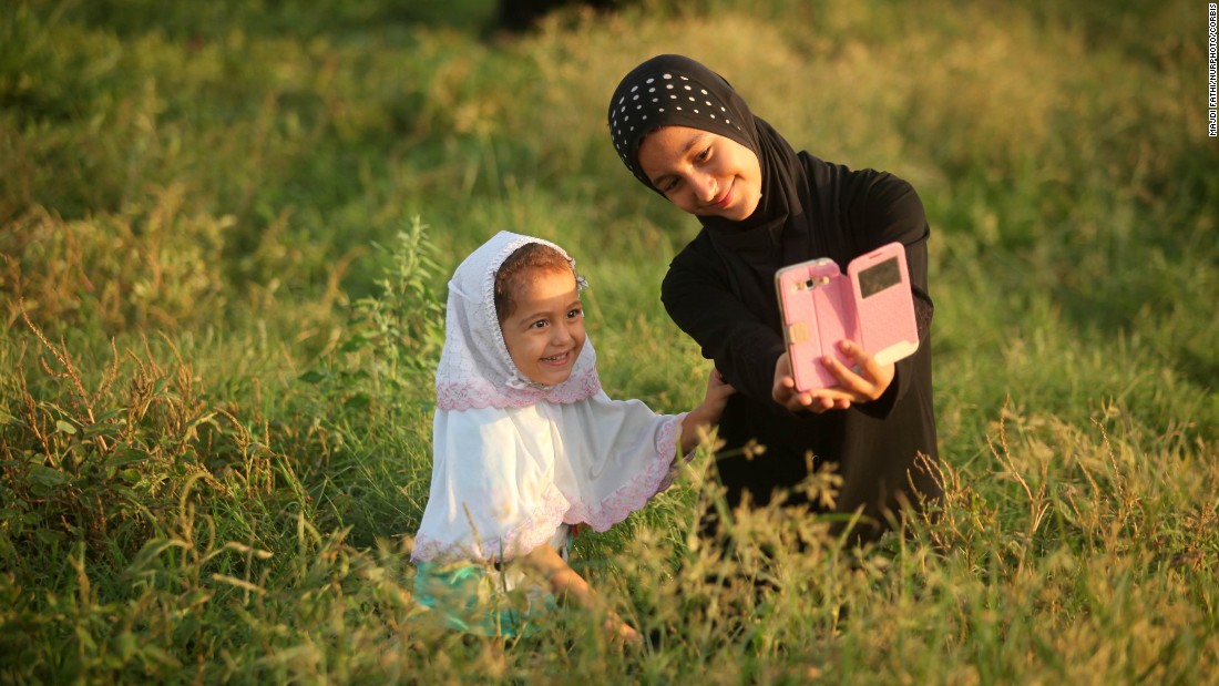 A girl in Gaza City takes a selfie Thursday, September 24, for Eid al-Adha, one of Islam&#39;s revered holidays.