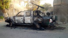 A burnt-out police pick-up truck stands in the street after Afghan security forces retook control of Kunduz city from the Taliban militants in northeastern Kunduz province, on October 1, 2015.  Afghan forces retook control of the strategic northern city of Kunduz on October 1 after a three-day Taliban occupation that dealt a stinging blow to the country's NATO-trained military.    AFP PHOTO        (Photo credit should read STR/AFP/Getty Images)