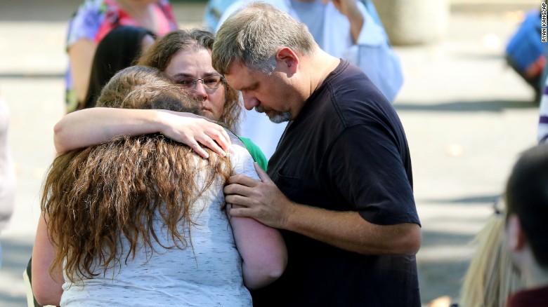 Students are reunited with friends and family after a deadly shooting at Umpqua Community College in Roseburg, Oregon, on Thursday, October 1. Preliminary information indicated that 10 people were killed and more than 20 were injured, police said. Douglas County Sheriff John Hanlin announced in a news conference that the shooter is dead.