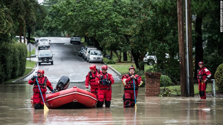 Rescue teams wait for an emergency vehicle in the Forest Acres neighborhood of Columbia, South Carolina, on Monday, October 5, 2015. South Carolina experienced record rainfall amounts over the weekend, forcing hundreds of evacuations and rescues.