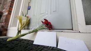 Bouquets and a cards sit on the front step of the home of Colin Brough, the student killed in a shooting at Northern Arizona University, Friday, Oct. 9, 2015, in Castle Rock, Colo. Brough, who graduated from Castle View High School in Castle Rock, died in the shooting in which three others were wounded. (AP Photo/David Zalubowski)