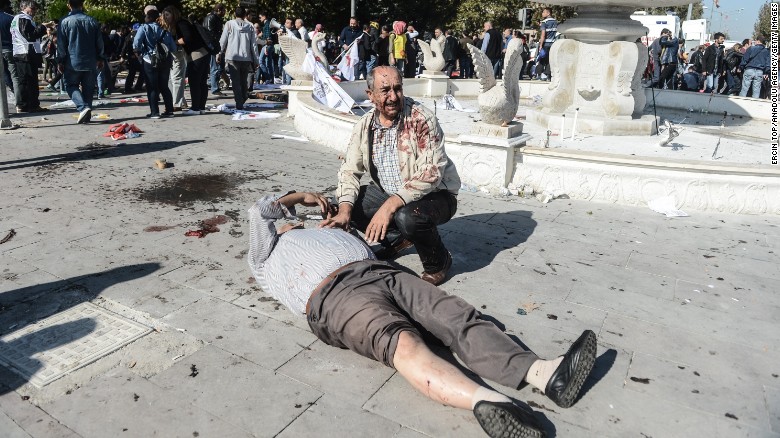 A wounded man lays on the ground at the site of an explosion in Ankara, Turkey, on Saturday, October 10. Two powerful bombs exploded near the main train station in Ankara on Saturday morning.
