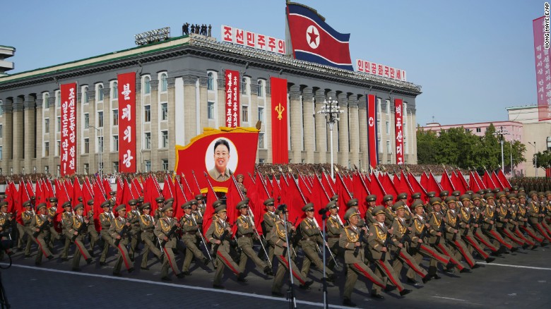 North Korean soldiers march beneath a portrait of late leader Kim Jong Il, Kim Jong Un's father, during the parade in Pyongyang.