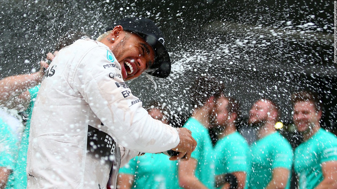 Hamilton was drenched in bubbly by his Mercedes team, which clinched its second successive constructors&#39; title despite Nico Rosberg failing to finish the race. 