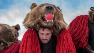 A troupe of bears from Asău village performs in central Comăneşti during the town's annual Bear Parade and Competition. December 30, 2014. Comăneşti town, Bacău county, Romania.