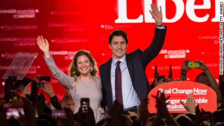 Canadian Liberal Party leader Justin Trudeau and his wife Sophie wave on stage in Montreal on October 20, 2015 after winning the general elections.    AFP PHOTO/NICHOLAS KAMM        (Photo credit should read NICHOLAS KAMM/AFP/Getty Images)