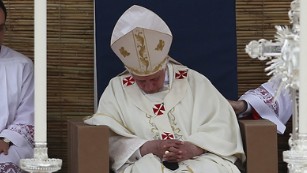 Pope Benedict XVI (C), 83 at the time, falls asleep during the celebration of a Pontifical Mass on the Granaries on April 18, 2010 in Floriana.