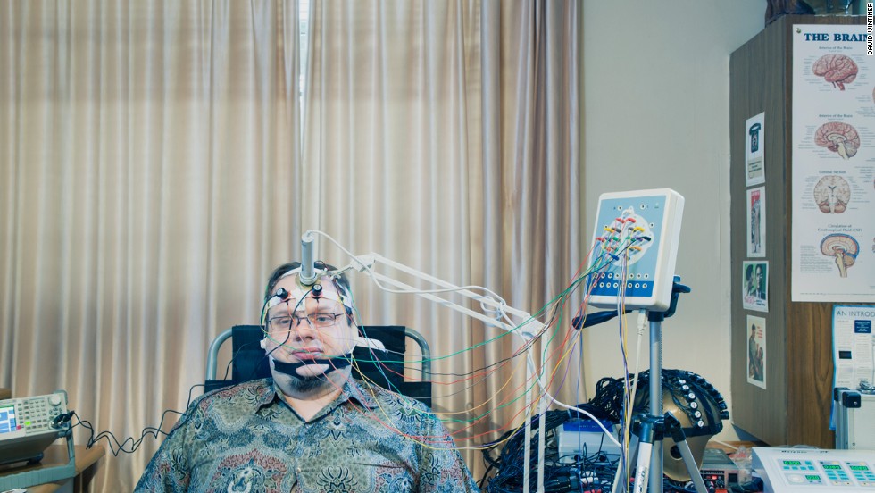 &quot;A futurist is someone who is not short-term thinking and who is trying to alter the course of events at least 10 years ahead or more,&quot; says Dr. Andrew Vladimirov. Based in the United Kingdom, Vladimirov is shown here demonstrating a device that shoots an infrared laser beam through the skull into the prefrontal cortex of the brain. The device is designed to learn more about &quot;what our brainwaves are for and what is consciousness,&quot; Vladimirov said. &quot;We are not the endpoint of evolution. We should enhance ourselves.&quot; 