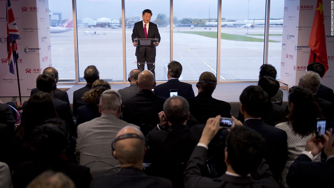 Chinese President Xi Jinping addresses an audience of dignitaries, including British Prime Minister David Cameron, at the Manchester airport in Manchester, England, on Friday, October 23. It was the end of a four-day state visit for Xi, who traveled to the United Kingdom with his wife, Peng Liyuan.