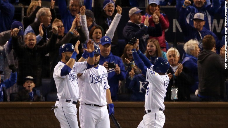The Kansas City Royals' Alex Rios, left; Kendrys Morales, center; and Alcides Escobar celebrate after scoring runs in the fifth inning Game 2 of the World Series against the New York Mets at Kauffman Stadium in Kansas City, Missouri, on Wednesday, October 28.
