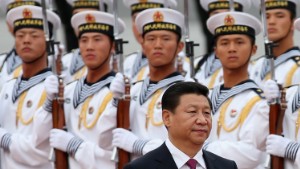 BEIJING, CHINA - SEPTEMBER 16: Chinese People&#39;s Liberation Army navy soldiers of a guard of honor look at Chinese President Xi Jinping (Front) during a welcoming ceremony for King Hamad Bin Isa Al Khalifa of Bahrain outside the Great Hall of People on September 16, 2013 in Beijing, China. At the invitation of Chinese President Xi Jinping, King Hamad Bin Isa Al Khalifa of Bahrain paid a state visit to China from September 14 to 16. (Photo by Feng Li/Getty Images)