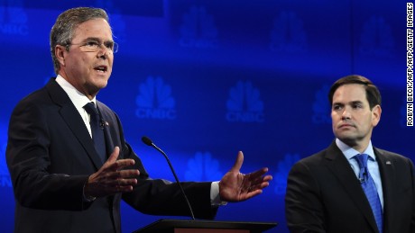 Republican Presidential hopeful Jeb Bush (L) speaks as Marco Rubio looks on during the CNBC Republican Presidential Debate, October 28, 2015 at the Coors Event Center at the University of Colorado in Boulder, Colorado. AFP PHOTO/ ROBYN BECK        (Photo credit should read ROBYN BECK/AFP/Getty Images)