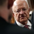 Director of National Intelligence James Clapper speaks with colleagues prior to testifying before the Senate Armed Services Committee September 29, 2015 in Washington, D.C.