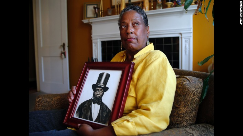 Ocea Thomas of Atlanta, here with a picture of her ancestor, Samuel D. Burris, helped write letters in support of a pardon for Burris. Delaware Gov. Jack Markell on Monday will pardon Burris, a free black man and conductor on the Underground Railroad who died in 1863. Burris was convicted of helping slaves escape to freedom in the 1840s.