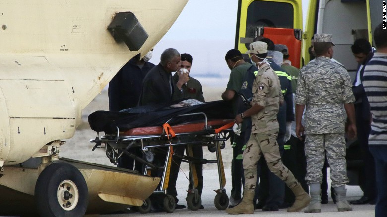 Egyptian emergency workers unload bodies of victims from the crash of a Russian aircraft carrying 217 passengers and 7 crew members over the Sinai peninsula from a police helicopter to ambulances at Kabrit airport in Suez, some 20 miles north of Suez, Egypt, Saturday, Oct. 31. A Russian Metrojet plane crashed Saturday morning in a mountainous region in the Sinai after taking off from Sharm el-Sheikh, killing all 224 people aboard. Officials said the pilot had reported a technical problem and was looking to make an emergency landing before radio contact with air traffic controllers went dead. 