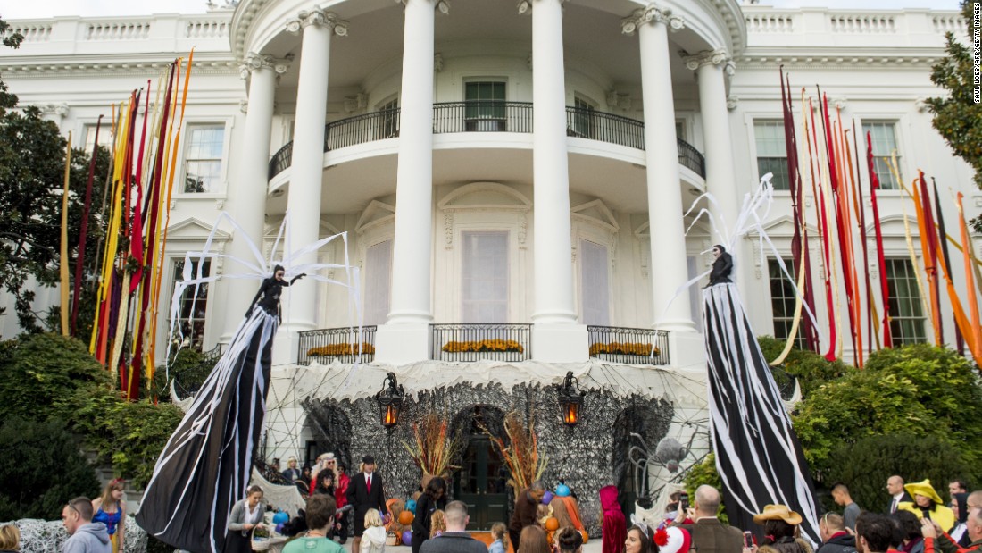 Obama and the first lady join a crowd of trick-or-treaters on the South Lawn of the White House on October 30.